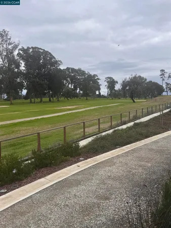 a view of a golf course with a lake