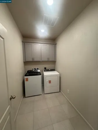 a utility room with washer and dryer