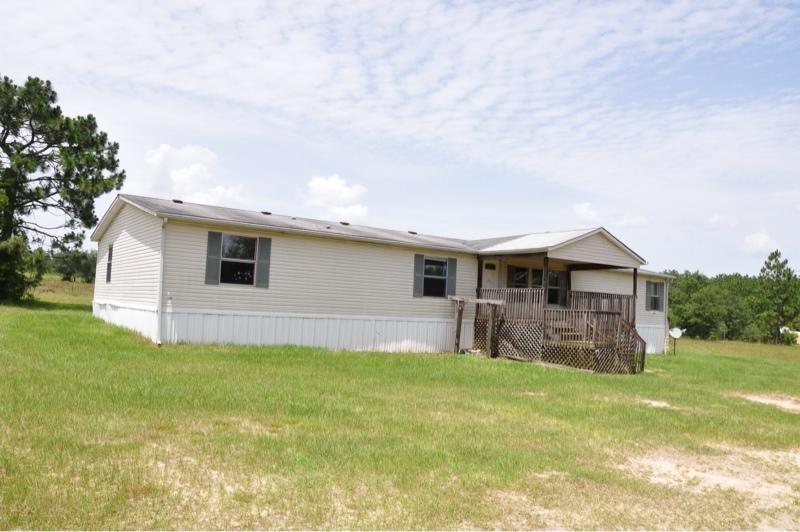 9960 Bellbrook Road Milton, FL 32583 - Photo 1 of 29 a house view with a sitting space and garden