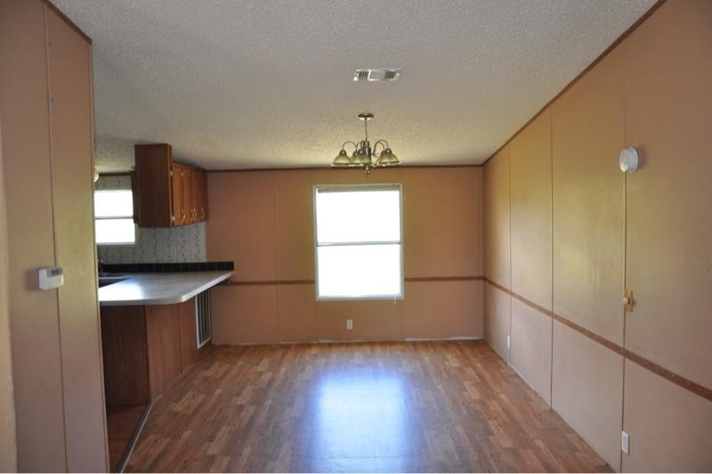 9960 Bellbrook Road Milton, FL 32583 - Photo 11 of 29 a room with window and wooden floor
