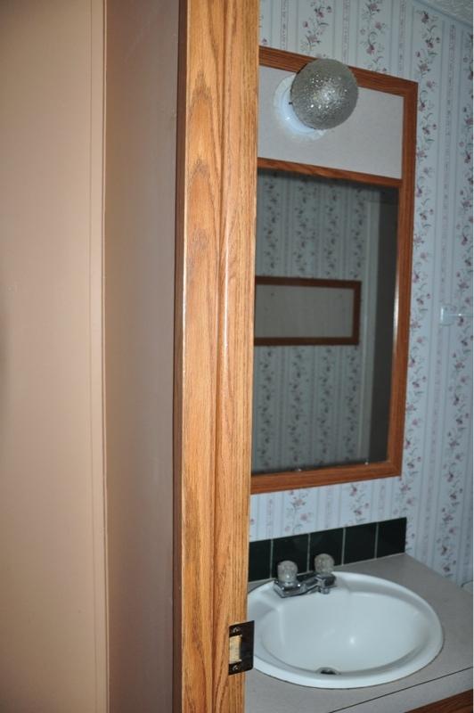 9960 Bellbrook Road Milton, FL 32583 - Photo 16 of 29 a bathroom with a sink and a mirror