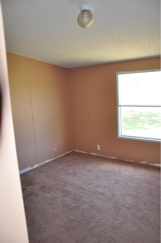 9960 Bellbrook Road Milton, FL 32583 - Photo 18 of 29 an empty room with a window