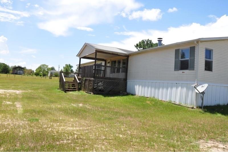 9960 Bellbrook Road Milton, FL 32583 - Photo 3 of 29 a view of a house with backyard and porch