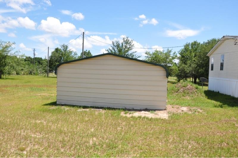 9960 Bellbrook Road Milton, FL 32583 - Photo 4 of 29 a house view with a garden space