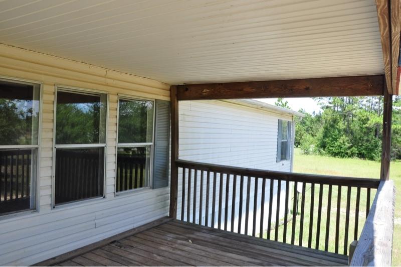 9960 Bellbrook Road Milton, FL 32583 - Photo 5 of 29 a view of a wooden deck