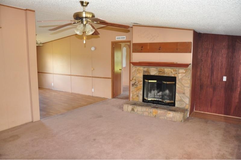 9960 Bellbrook Road Milton, FL 32583 - Photo 7 of 29 a view of a fireplace with washer and fireplace