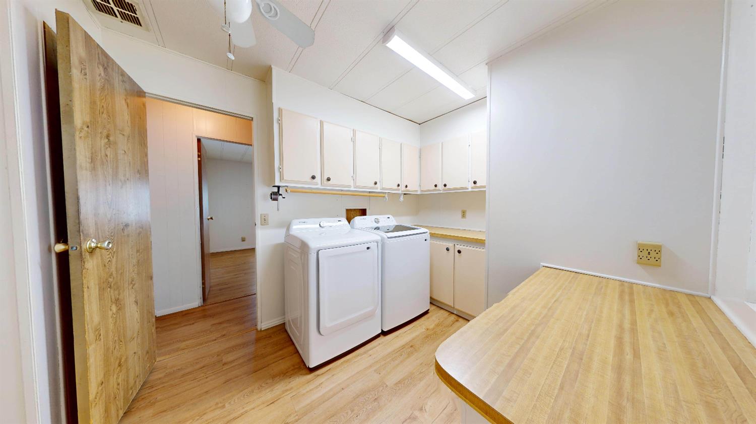 167 Clipper Lane Modesto, CA 95356 - Photo 11 of 23 a view of a kitchen with wooden floor