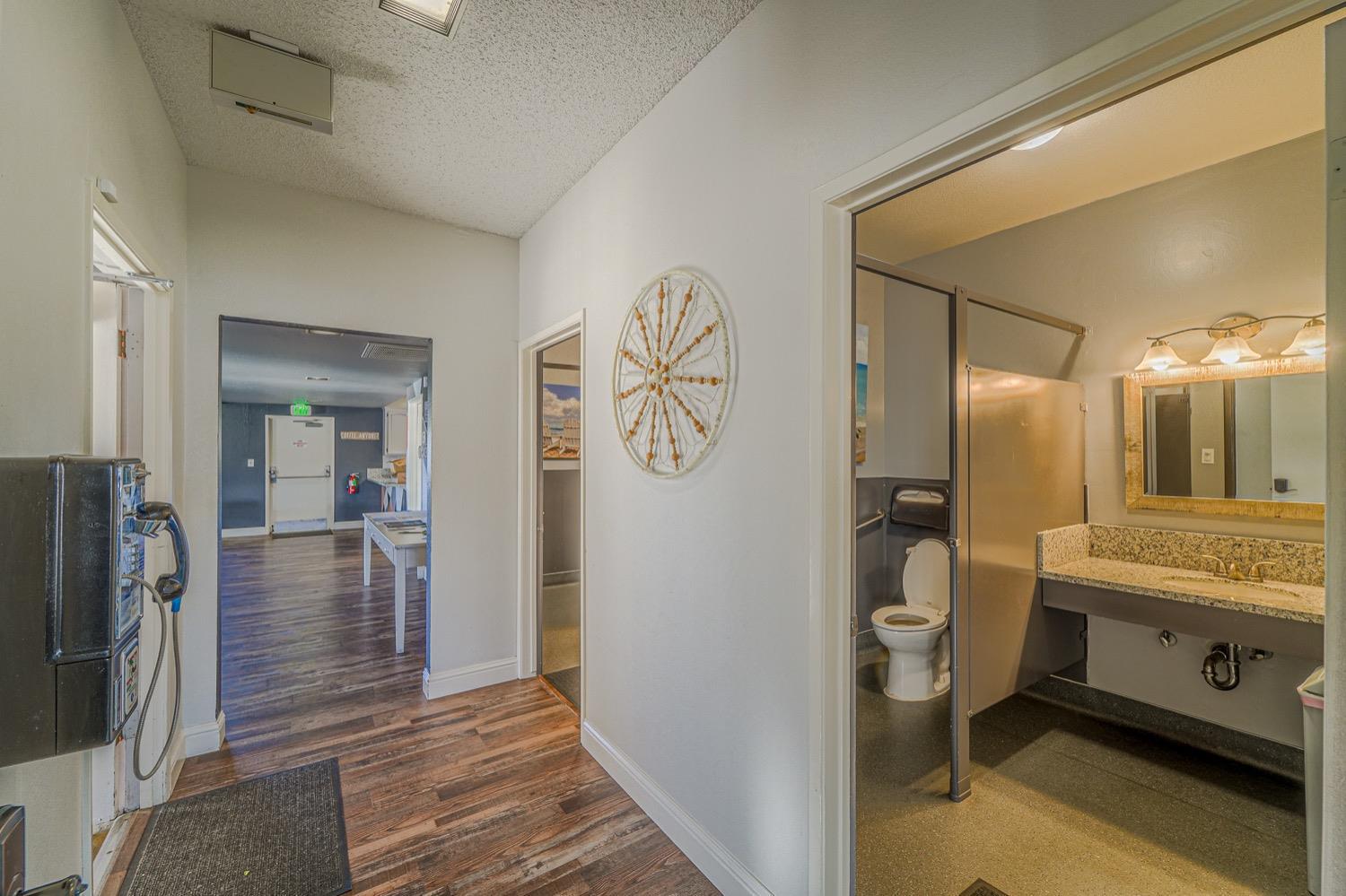 167 Clipper Lane Modesto, CA 95356 - Photo 17 of 23 a bathroom with a toilet a sink and mirror
