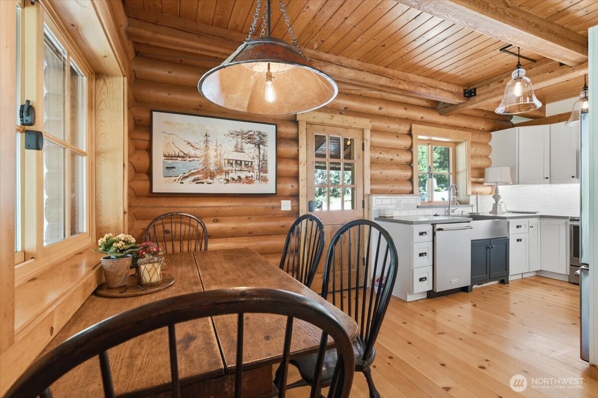 2250 First Crk Road Chelan, WA 98816 - Photo 12 of 39 a dining room with furniture a chandelier and window