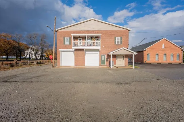 a view of a house with a street