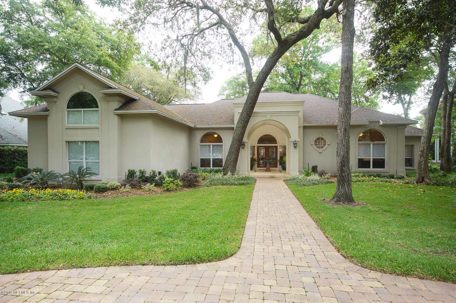 a view of house with yard and green space