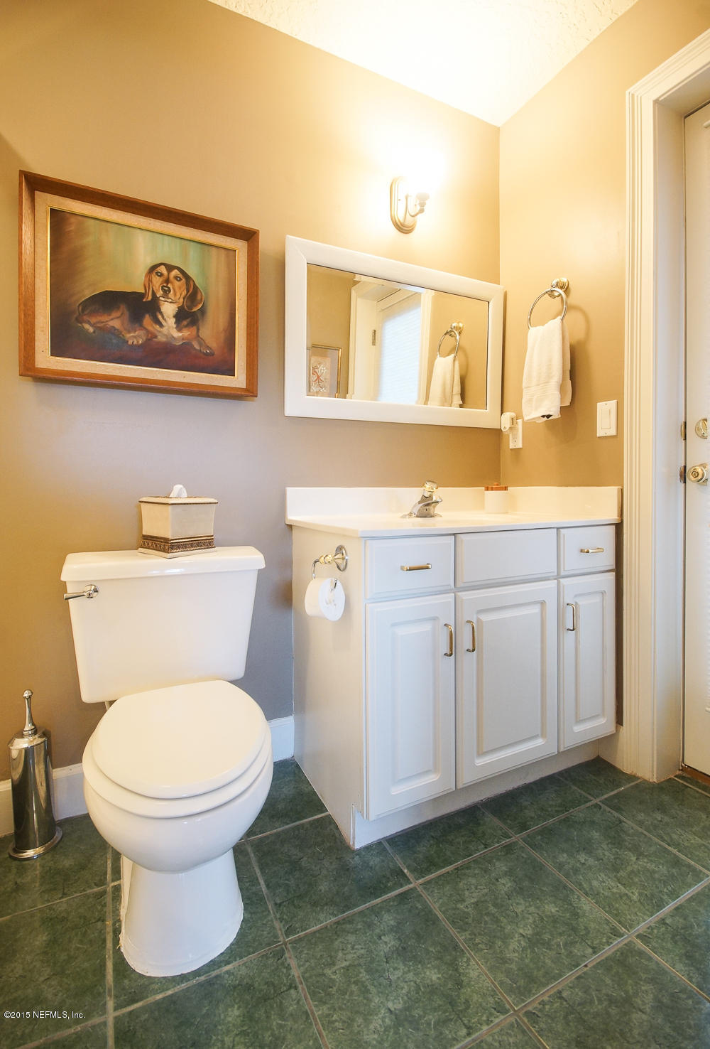 829 Queens Harbor Boulevard Jacksonville, FL 32225 - Photo 13 of 42 a bathroom with a toilet a sink and mirror