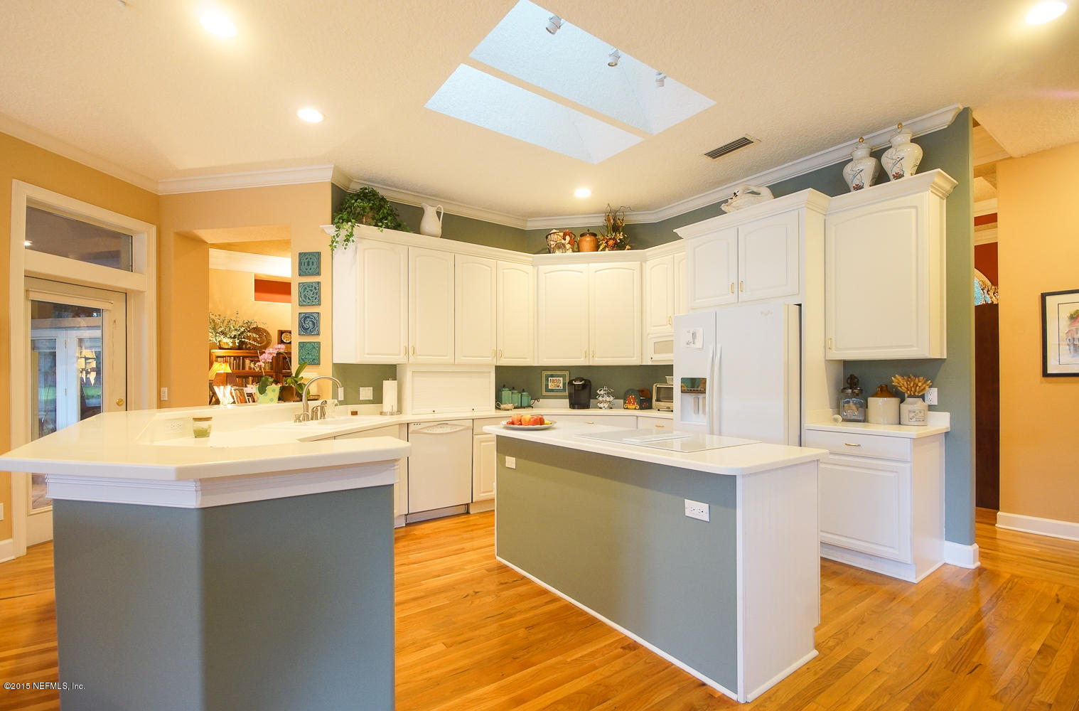 829 Queens Harbor Boulevard Jacksonville, FL 32225 - Photo 15 of 42 a kitchen with kitchen island a sink a stove and a refrigerator
