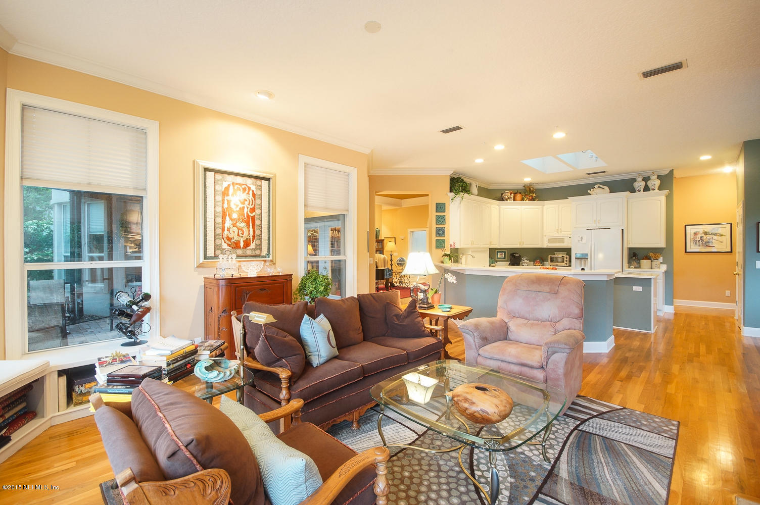 829 Queens Harbor Boulevard Jacksonville, FL 32225 - Photo 18 of 42 a living room with furniture wooden floor and a large window