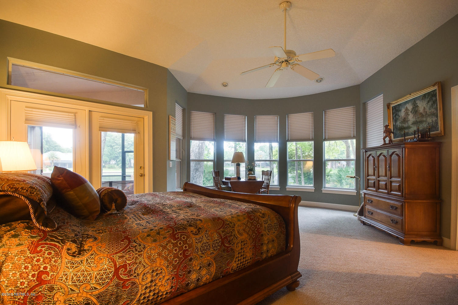 829 Queens Harbor Boulevard Jacksonville, FL 32225 - Photo 24 of 42 a large bedroom with a bed and a large window