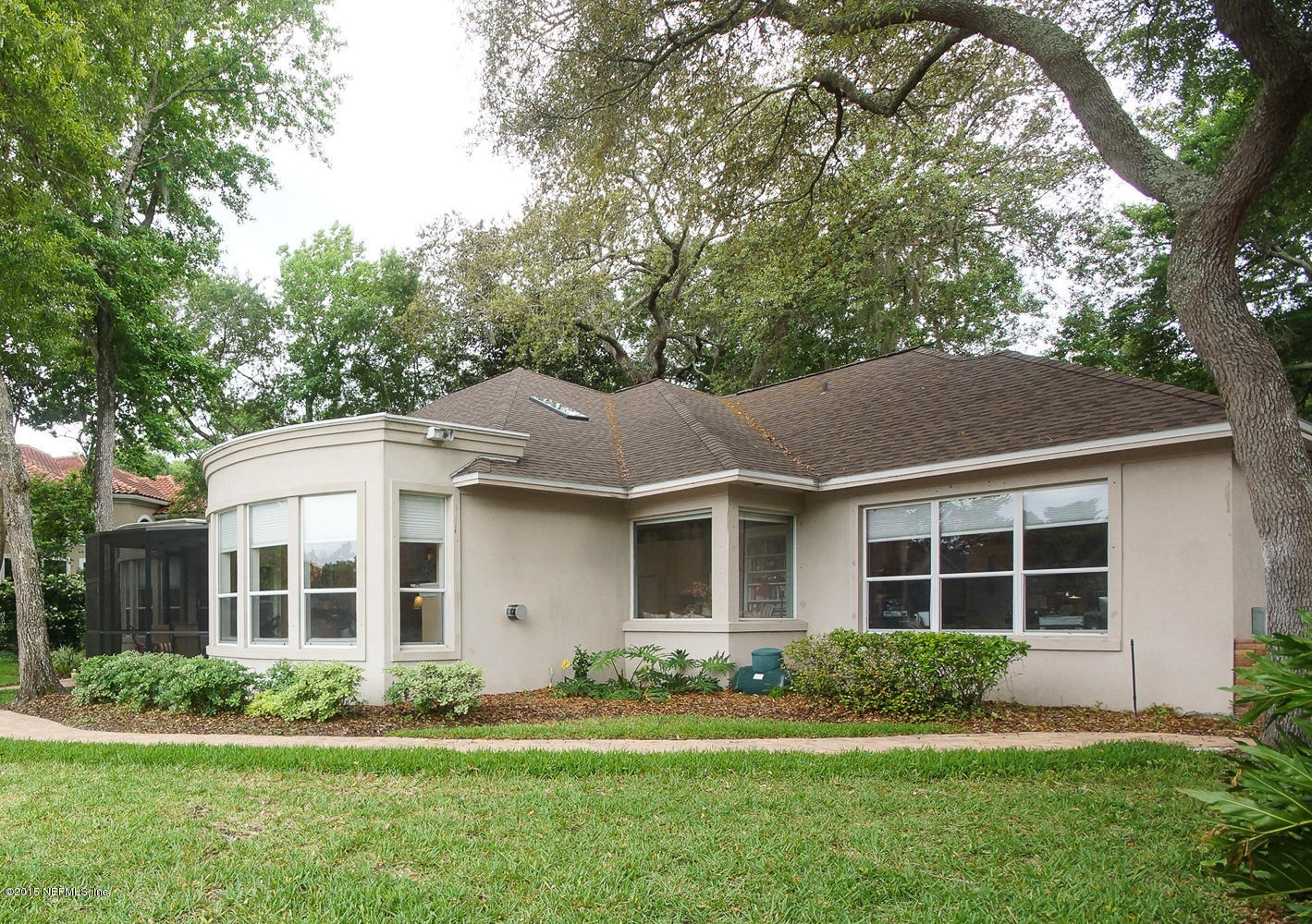 829 Queens Harbor Boulevard Jacksonville, FL 32225 - Photo 31 of 42 a front view of a house with a yard and plants