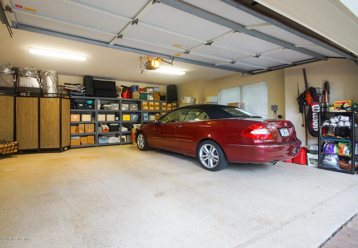829 Queens Harbor Boulevard Jacksonville, FL 32225 - Photo 38 of 42 a car parked in a garage
