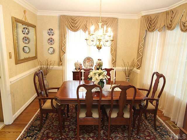 8805 Lomas Court Raleigh, NC 27615 - Photo 5 of 25 Enjoy all types of dining in this lovely formal/separate dining room. Note the trim work and hardwood floors. Dining Room