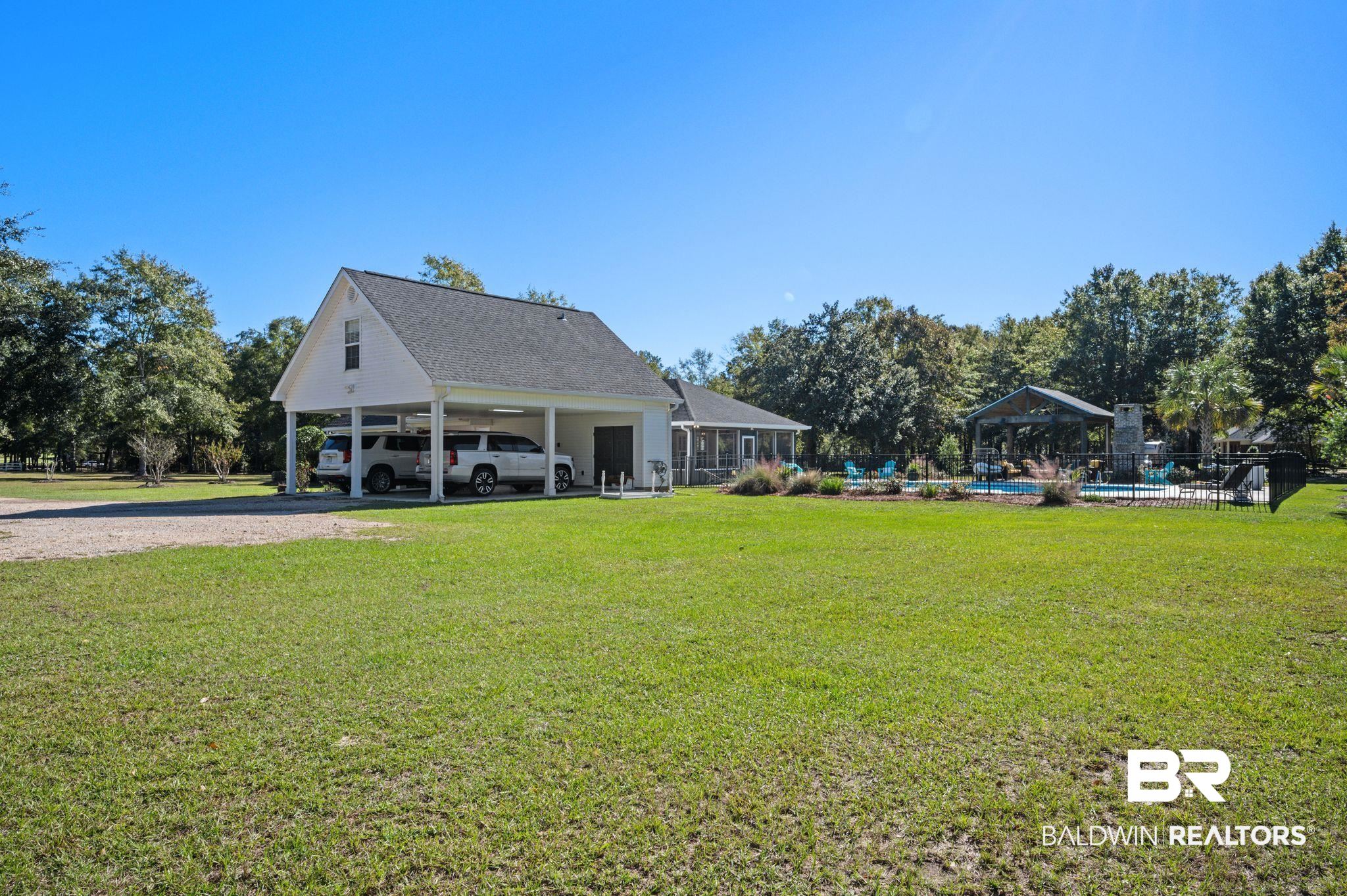 38211-d) V R Byrd Road Bay Minette, AL 36507 - Photo 40 of 58 Exterior space with a sunroom and a carport