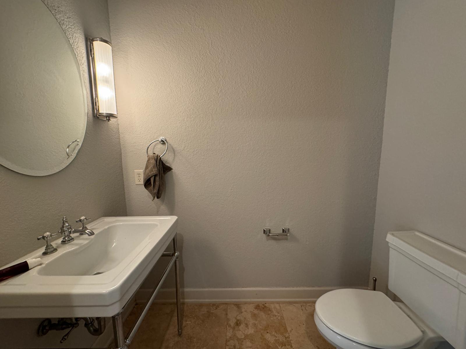 241 Inverrary Drive Destin, FL 32541 - Photo 8 of 24 a bathroom with a sink a toilet and mirror