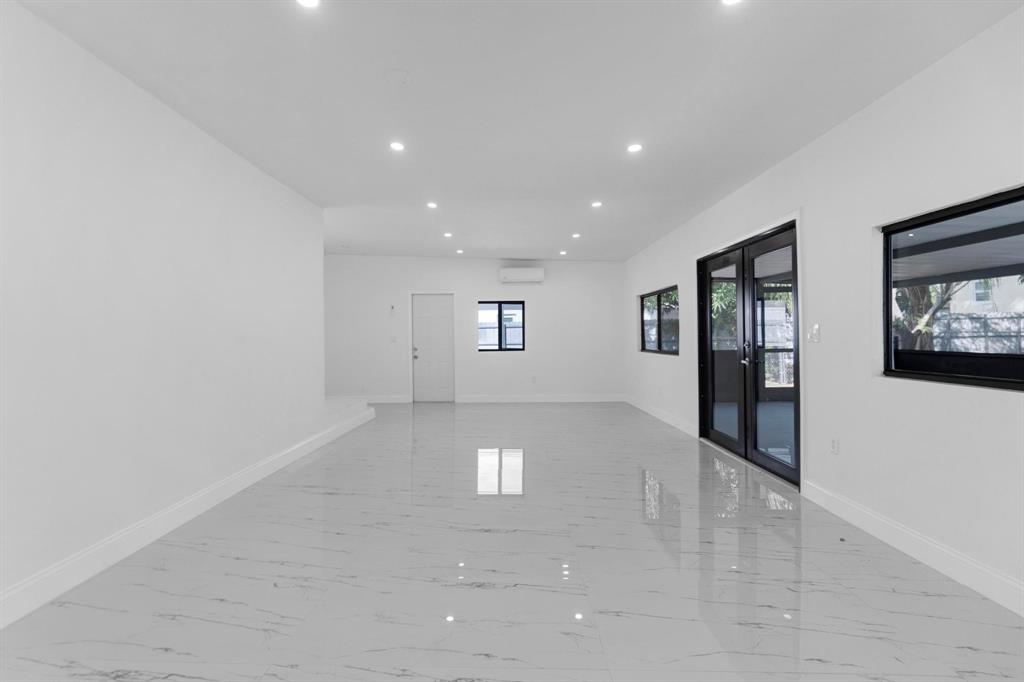 16011 Northwest 38th Court Opa-Locka, FL 33054 - Photo 22 of 38 a view of a big room with windows and cabinet