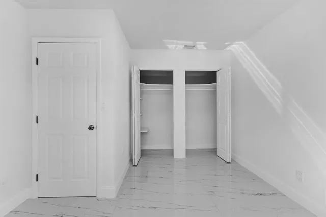 a view of house with backyard