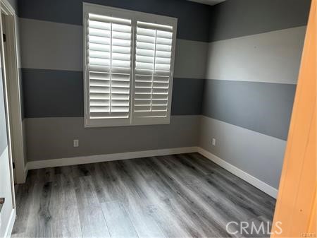 9044 Garvey Avenue, Unit 21 Rosemead, CA 91770 - Photo 14 of 20 a view of an empty room with wooden floor and a window