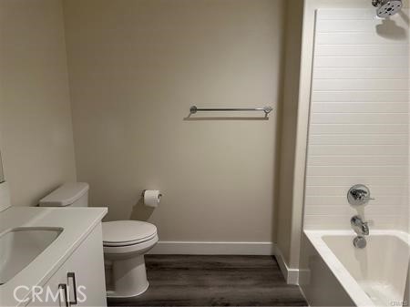 9044 Garvey Avenue, Unit 21 Rosemead, CA 91770 - Photo 19 of 20 a white toilet sitting next to a bathroom sink