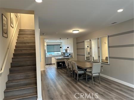 9044 Garvey Avenue, Unit 21 Rosemead, CA 91770 - Photo 7 of 20 a dining room with furniture and wooden floor
