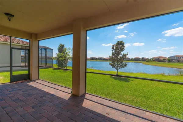 a view of a living room and floor to ceiling window or swimming pool