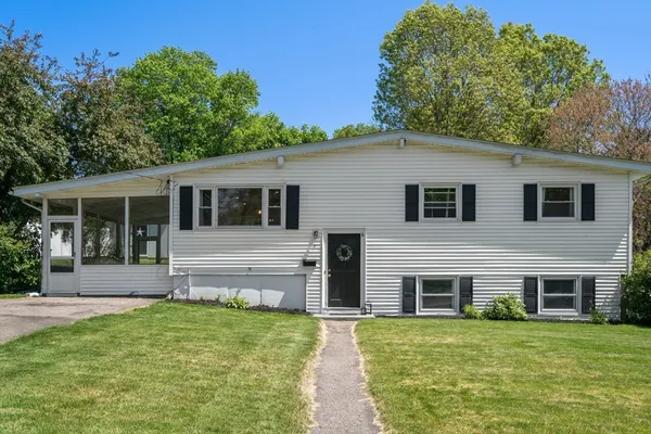 a front view of a house with a yard