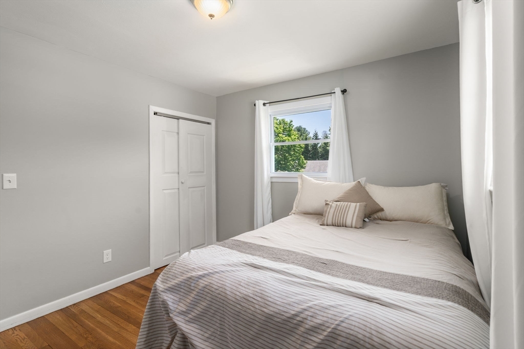 6 Rosenfeld Road Millis, MA 02054 - Photo 12 of 23 a bedroom with a large bed and a window