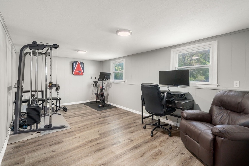 6 Rosenfeld Road Millis, MA 02054 - Photo 16 of 23 a livingroom with workspace a couch and a window