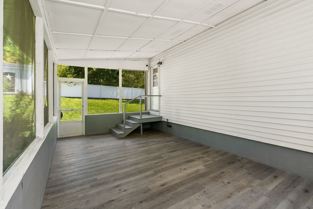 6 Rosenfeld Road Millis, MA 02054 - Photo 18 of 23 a view of a room with furniture wooden floor and a window
