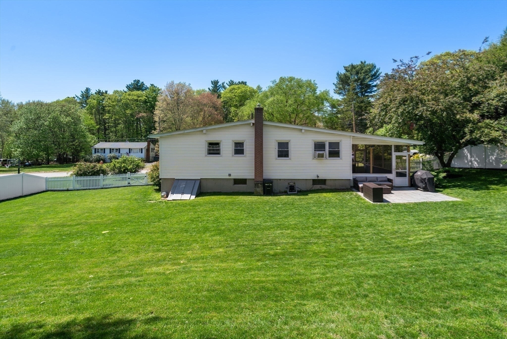 6 Rosenfeld Road Millis, MA 02054 - Photo 22 of 23 a view of a backyard with plants and a garden