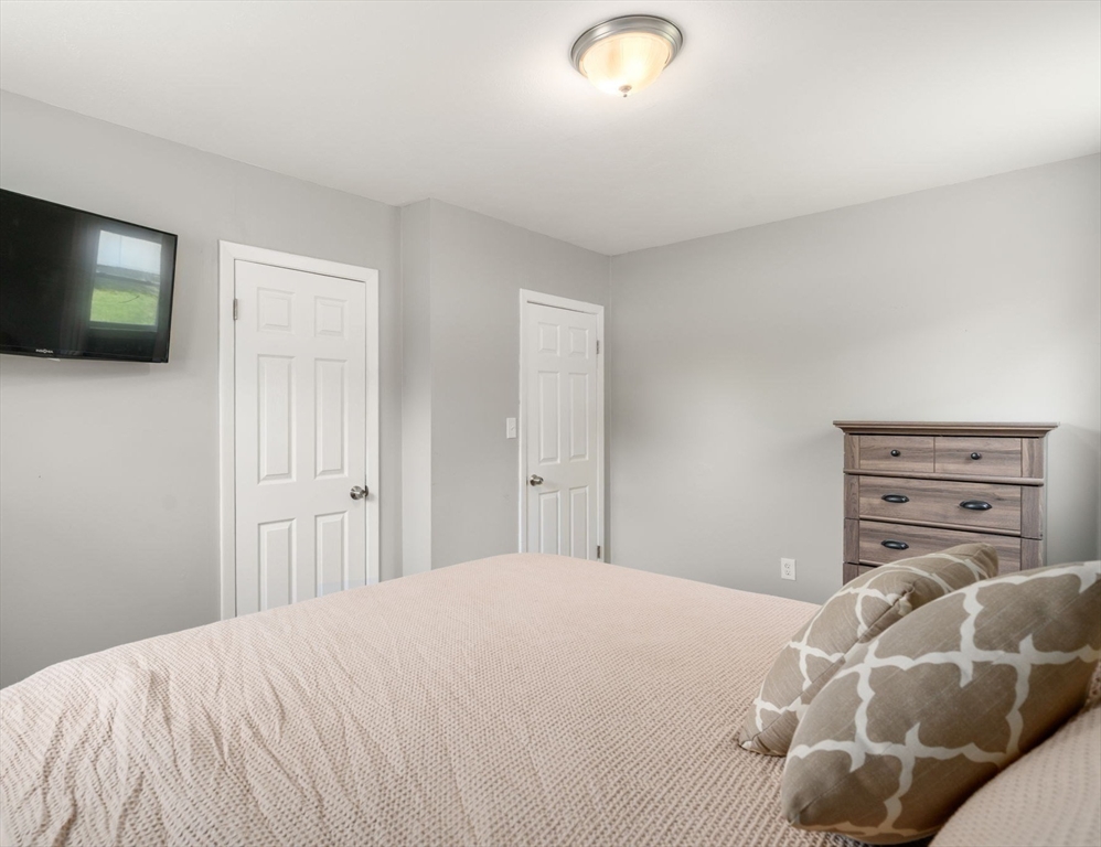 6 Rosenfeld Road Millis, MA 02054 - Photo 10 of 23 a bedroom with a bed and a television