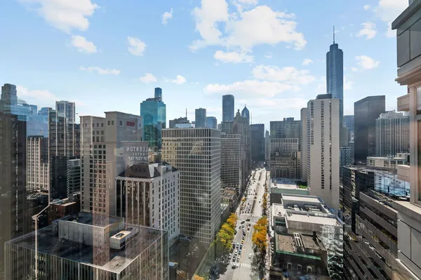 a living room with furniture and large windows
