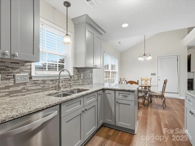 a kitchen with lots of counter top space and dining table