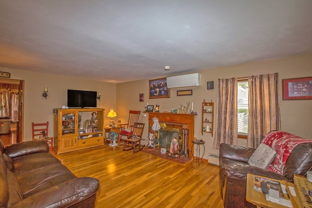 165 Bacon Road Springfield, MA 01119 - Photo 11 of 40 a room with furniture and a flat screen tv