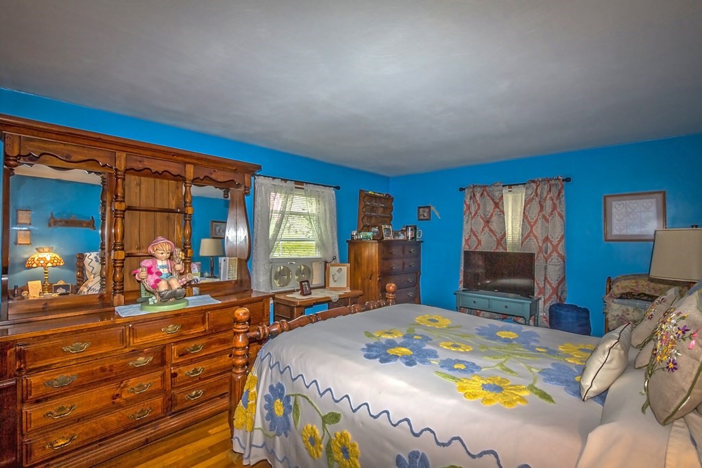 165 Bacon Road Springfield, MA 01119 - Photo 20 of 40 a bed room with a bed and a large mirror