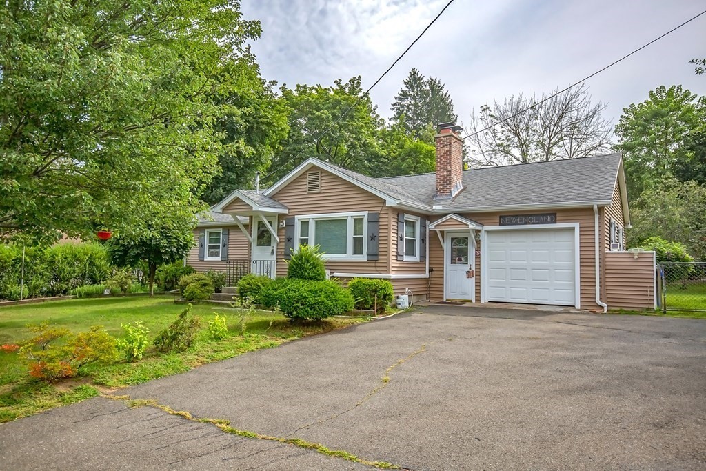 165 Bacon Road Springfield, MA 01119 - Photo 2 of 40 a front view of a house with a yard and garage