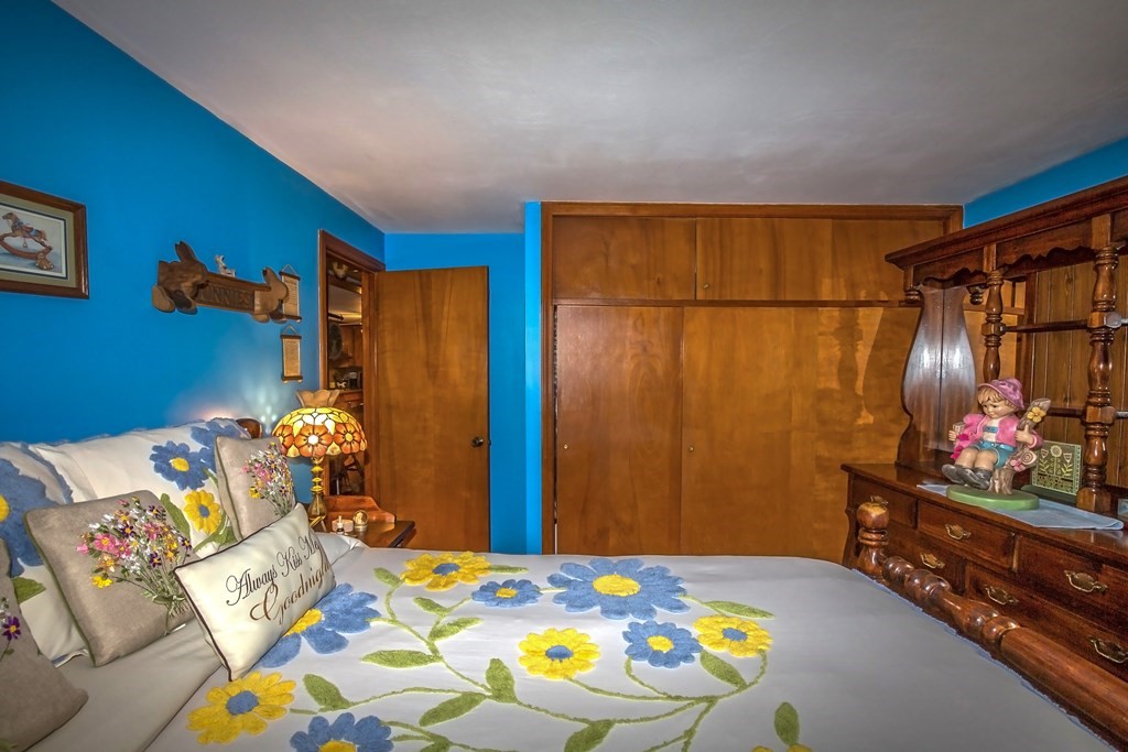 165 Bacon Road Springfield, MA 01119 - Photo 21 of 40 a bedroom with a bed and a dresser in it
