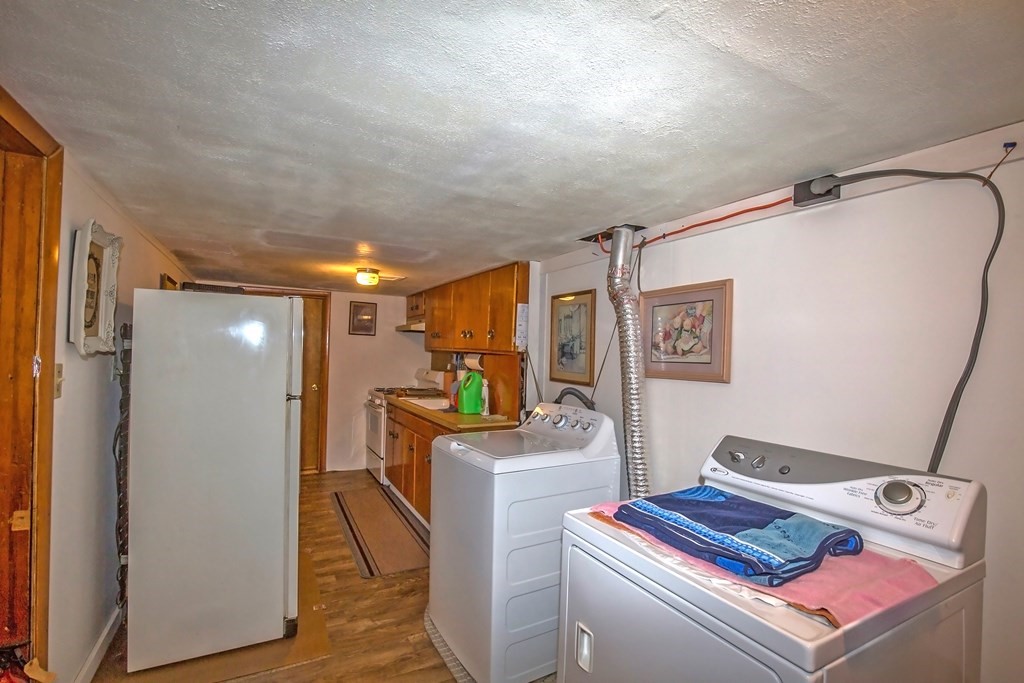 165 Bacon Road Springfield, MA 01119 - Photo 32 of 40 a storage room with washer and dryer