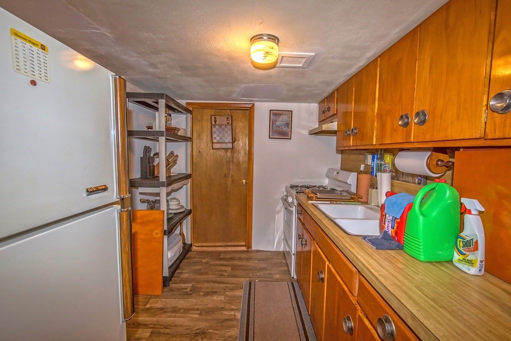 165 Bacon Road Springfield, MA 01119 - Photo 33 of 40 a kitchen with stainless steel appliances granite countertop a refrigerator and a sink