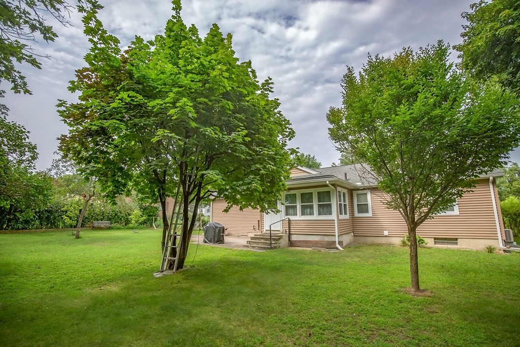 165 Bacon Road Springfield, MA 01119 - Photo 8 of 40 a front view of a house with a garden