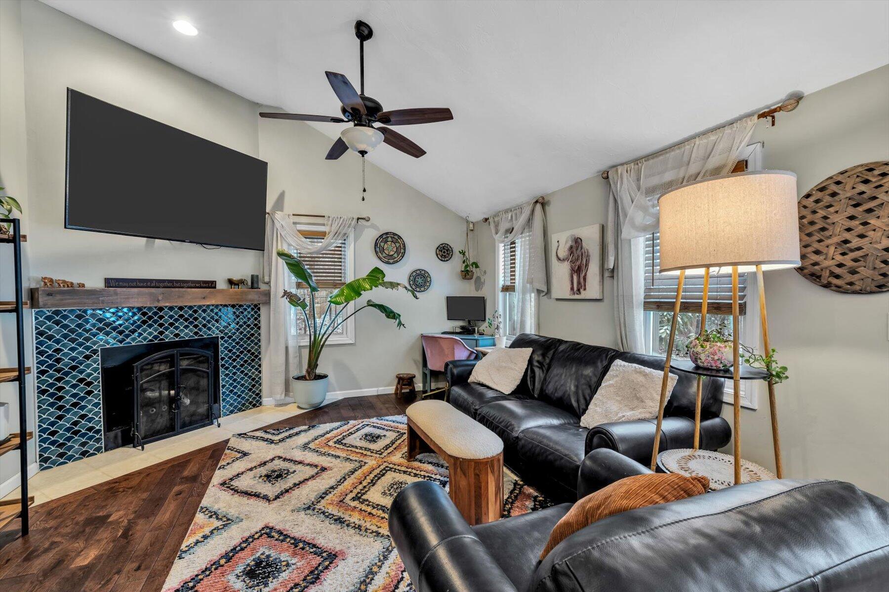 7 Summer Street Wareham, MA 02571 - Photo 11 of 41 a living room with furniture a flat screen tv and a fireplace