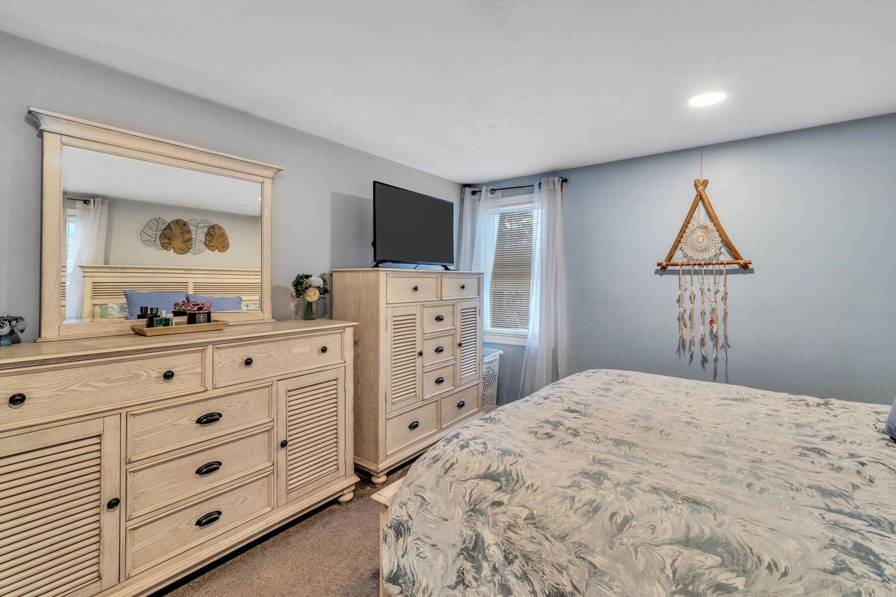 7 Summer Street Wareham, MA 02571 - Photo 18 of 41 a bedroom with a bed and a dresser