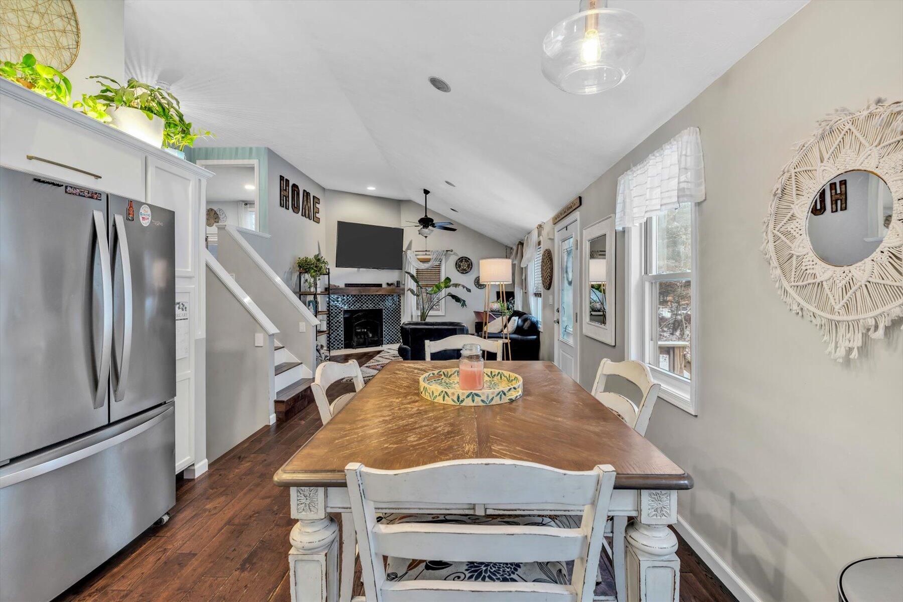 7 Summer Street Wareham, MA 02571 - Photo 8 of 41 a kitchen with stainless steel appliances granite countertop a refrigerator a stove top oven a sink dishwasher and white cabinets with wooden floor