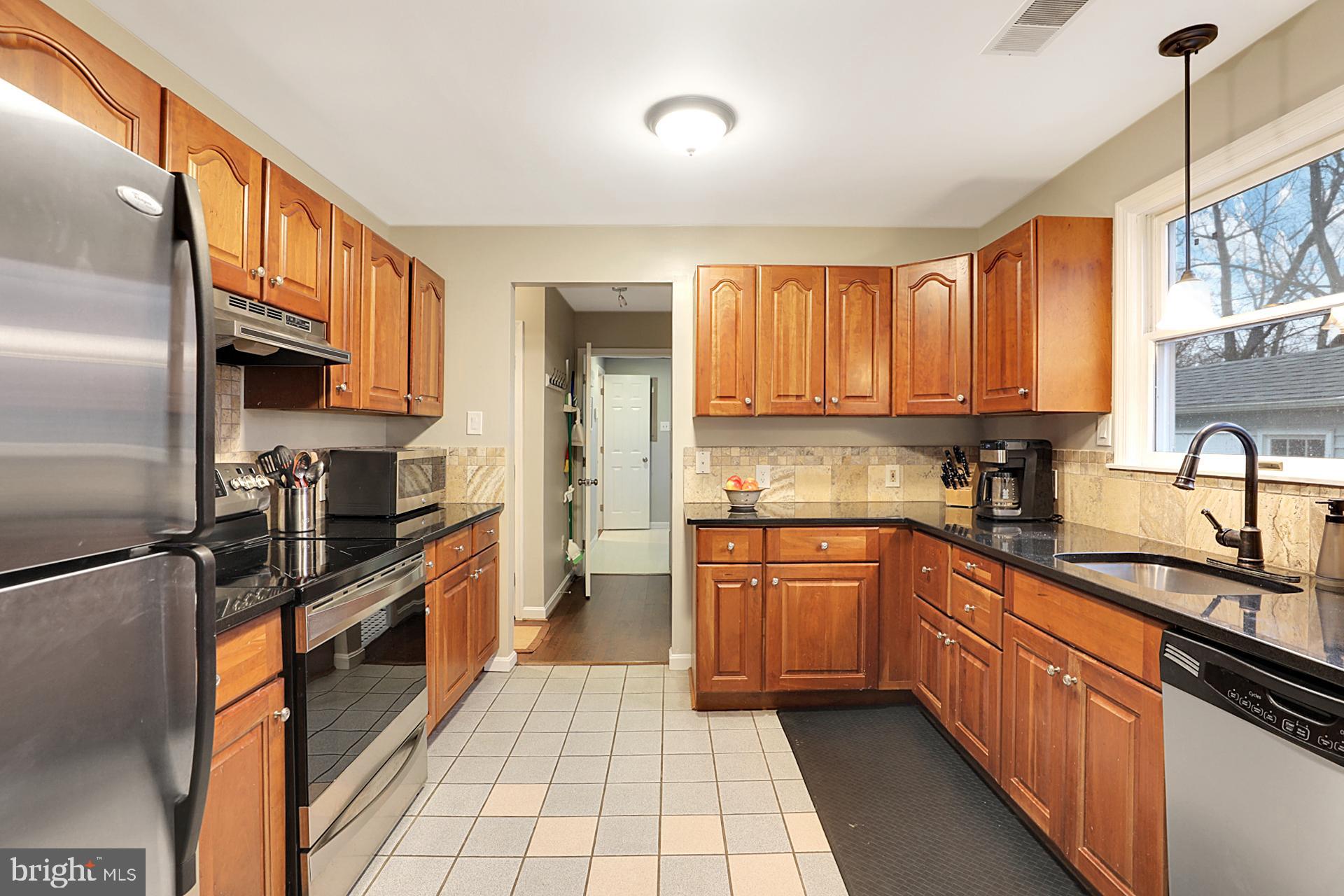 3008 Findley Road Kensington, MD 20895 - Photo 9 of 33 Kitchen with cherry cabinets and granite counters