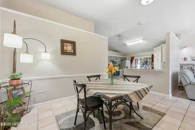 a view of a dining room with furniture